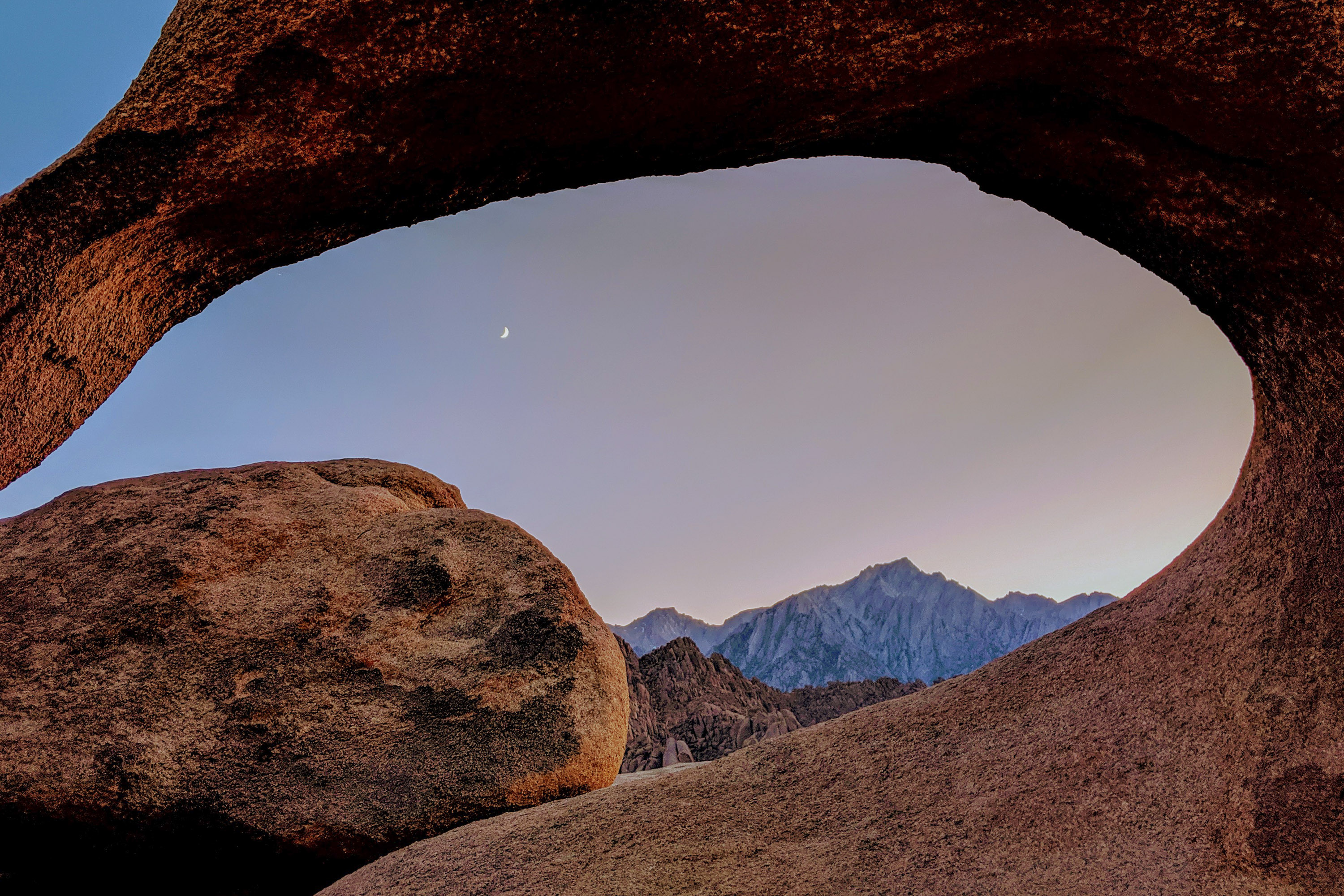 Moonrise through Mobius Arch