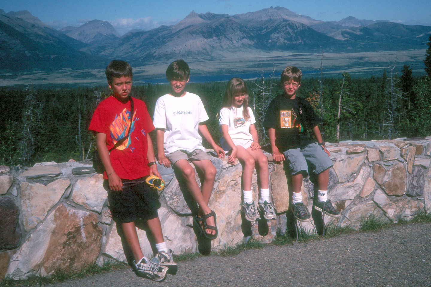 Kids on drive between Glacier and Waterton Kids on drive between Glacier and Waterton