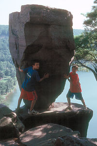 Boys holding up Balance Rock