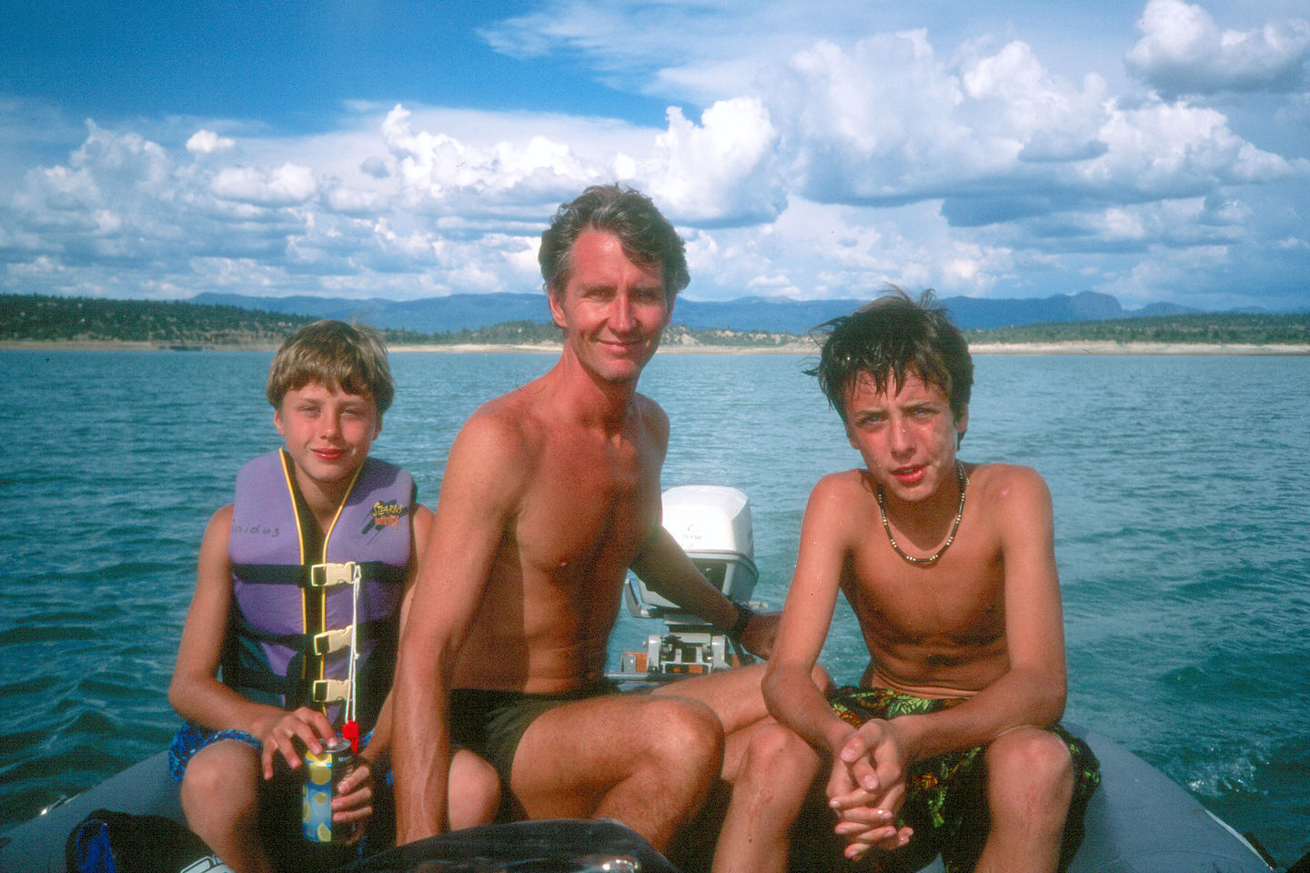 Herb and the boys on blowup boat in Heron Lake