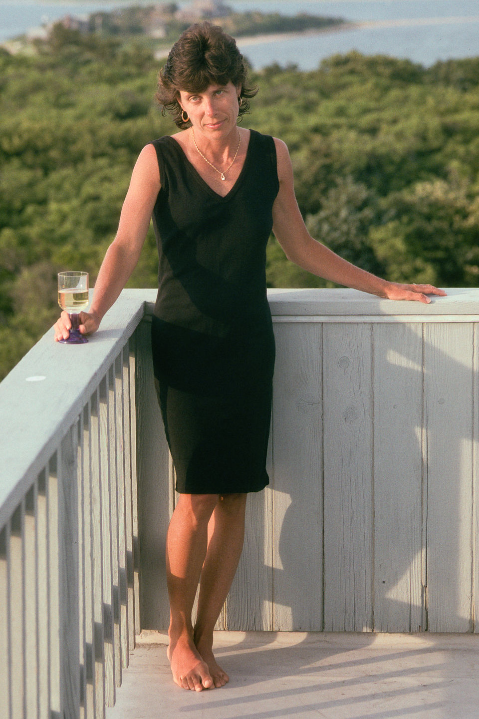 Lolo in Black Dress on Deck of "Gut House"