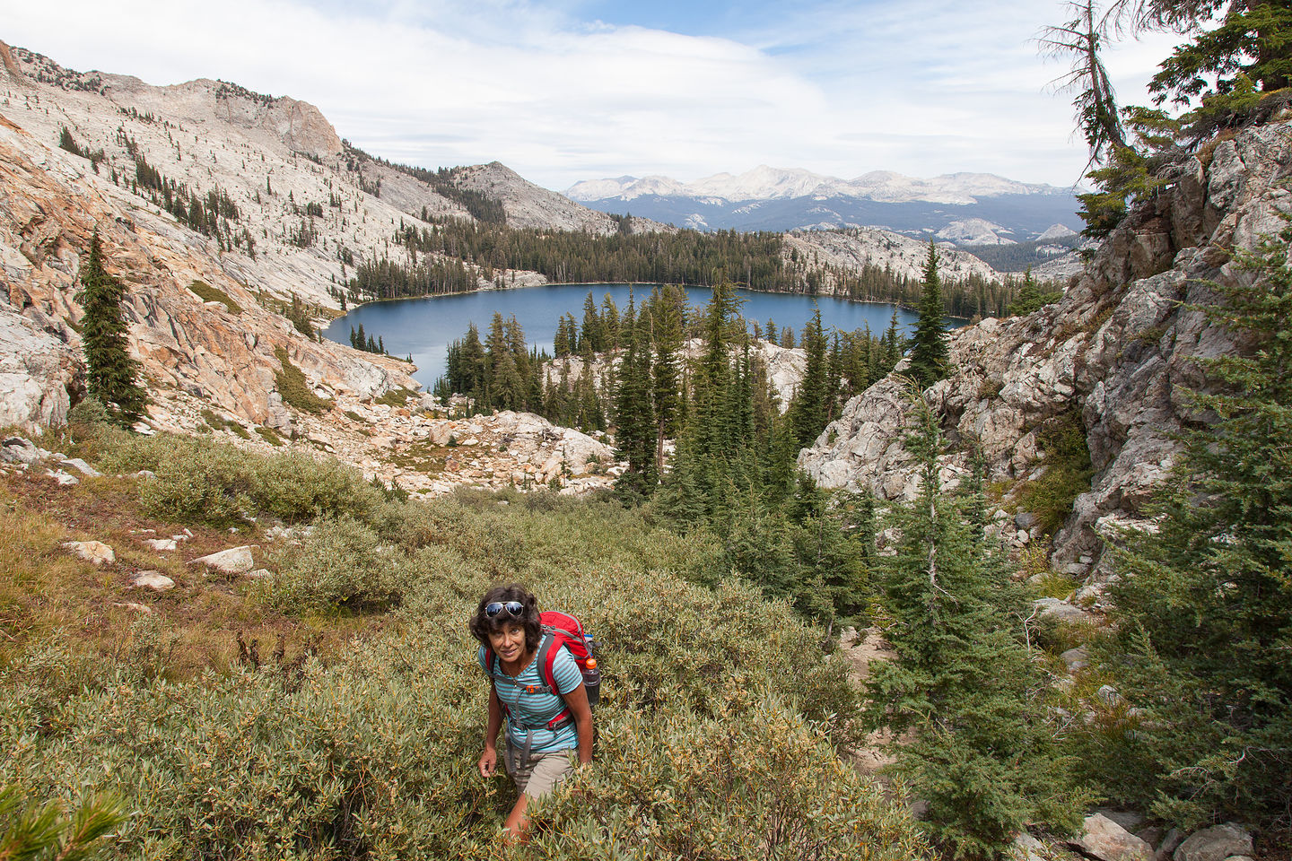Lolo Hiking with May Lake in Background