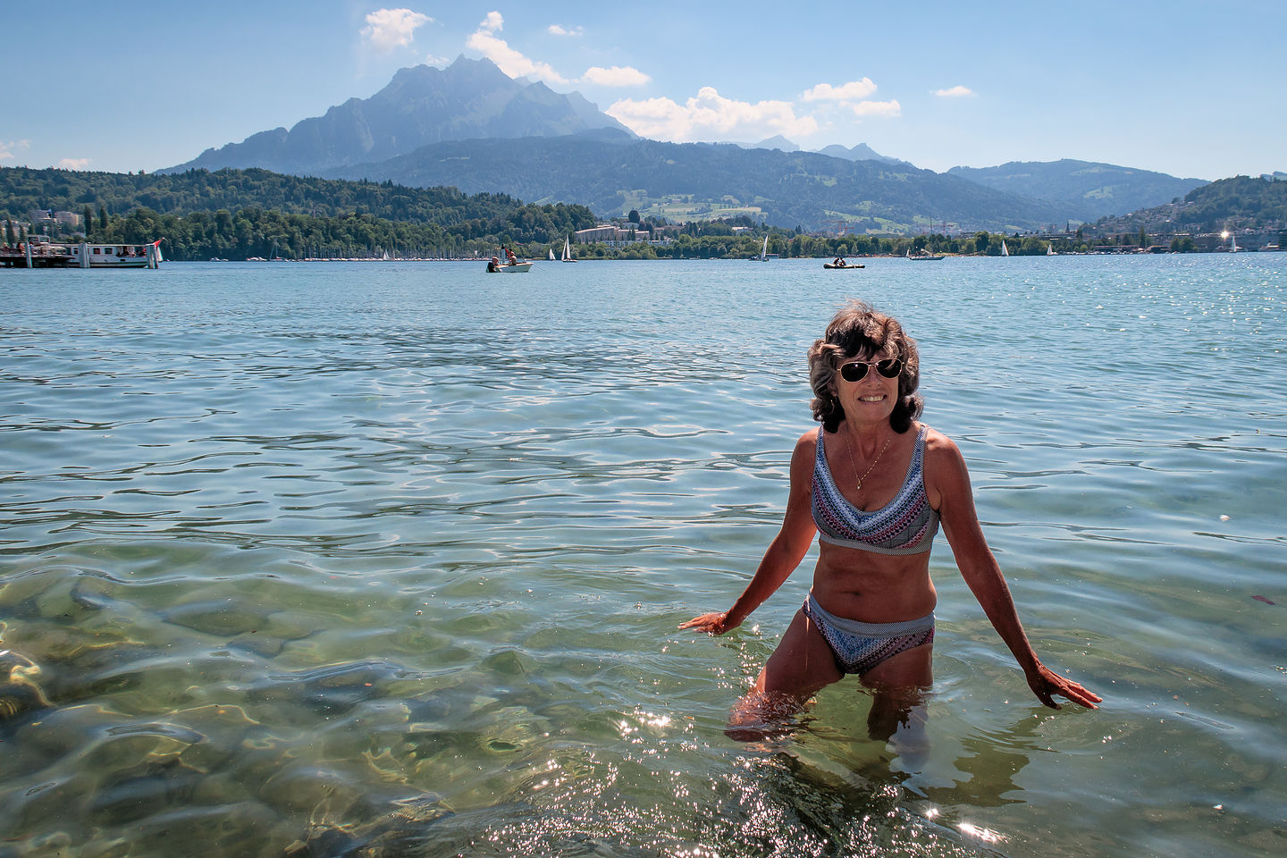 Lolo frolicking in Lake Lucerne with Mt. Pilatus peeking