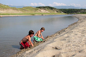 Boy's building sand castles at Broom Point