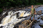 Tommy by waterfall in campground