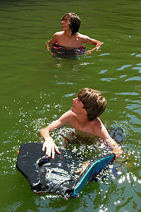 Boy's demonstrating the use of the scrotum squeezer