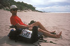 Herb beaching with smokestacks in background