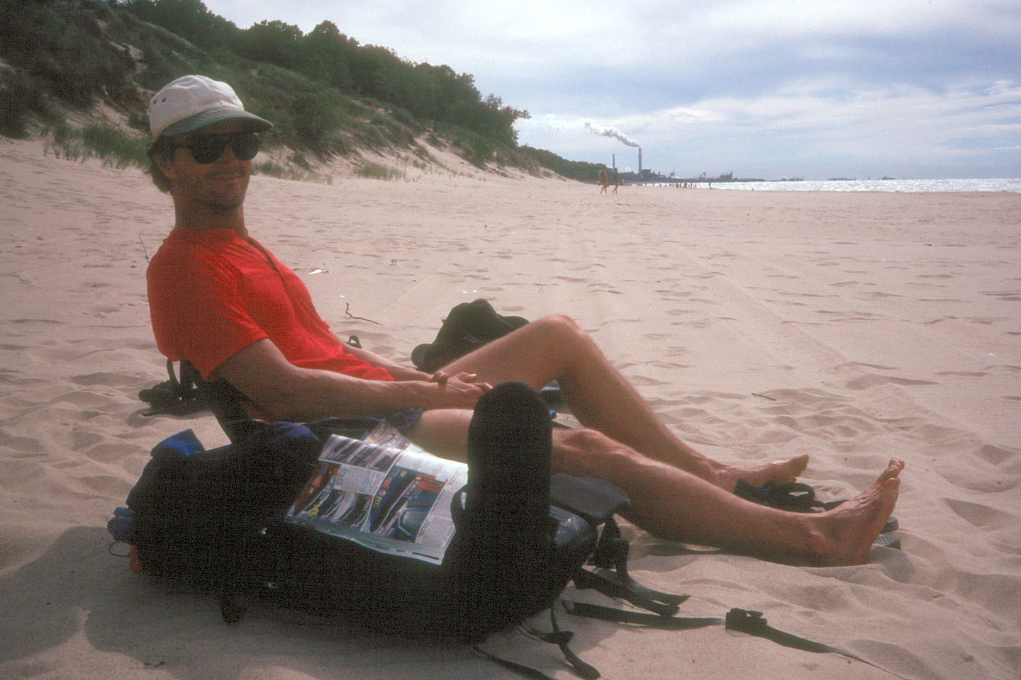 Herb beaching with smokestacks in background