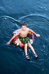 Andrew tubing the Yampa River through campground