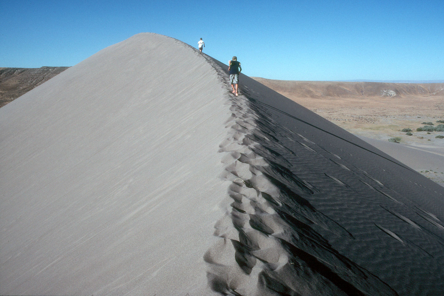 Boys on knife edge of the dunes