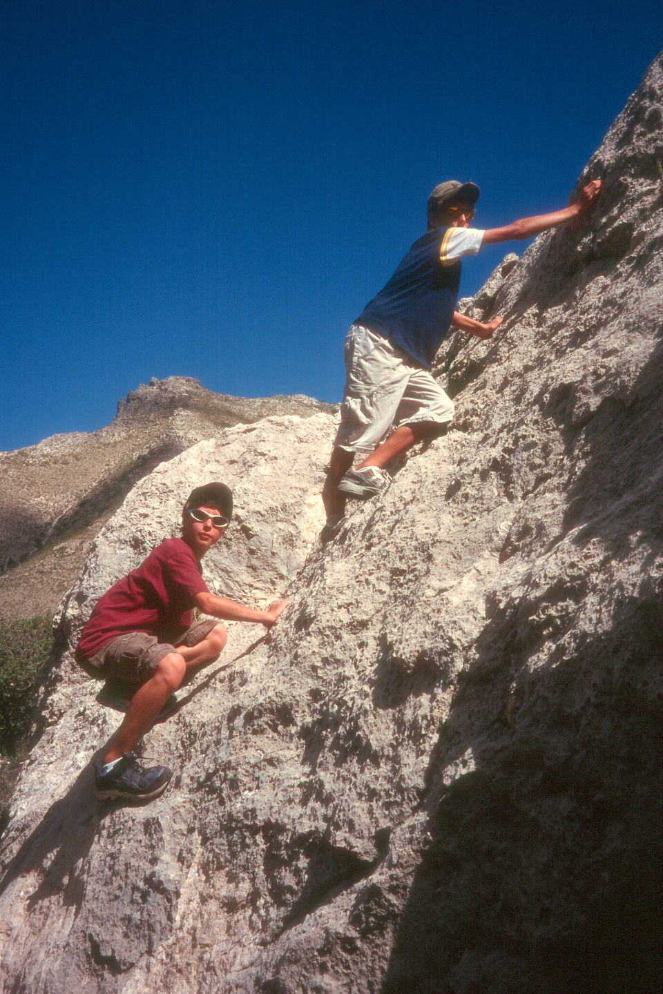 Boys rock scrambling on Devils Hall Trail Boys rock scrambling on Devils Hall Trail