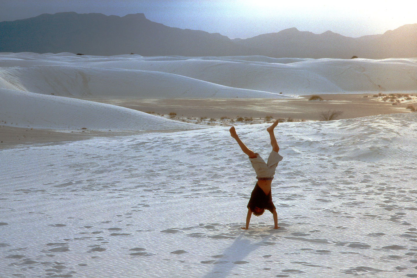 Andrew doing handstand on dunes Andrew doing handstand on dunes