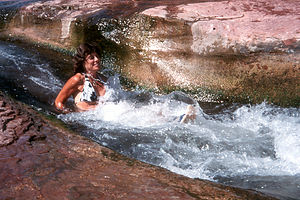 Lolo sliding the slide rock gorge