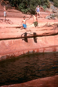 Boys jumping in Slide Rock State Park