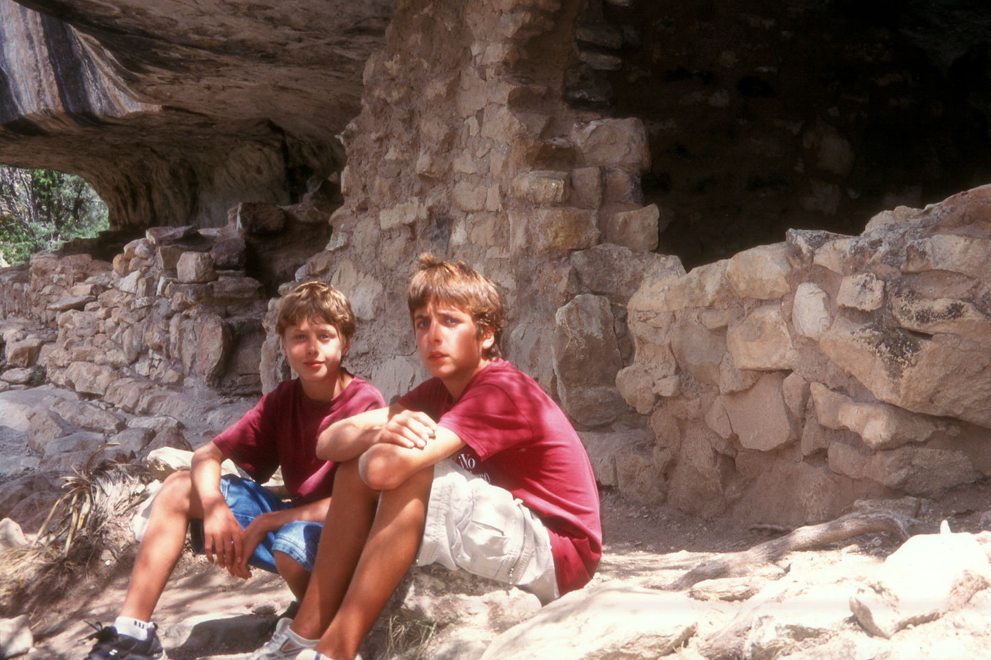 Boys in ancient cliff dwelling Boys in ancient cliff dwelling