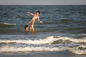 Boys goofing on boogie board