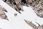 Boys helping Lolo across the snowfield