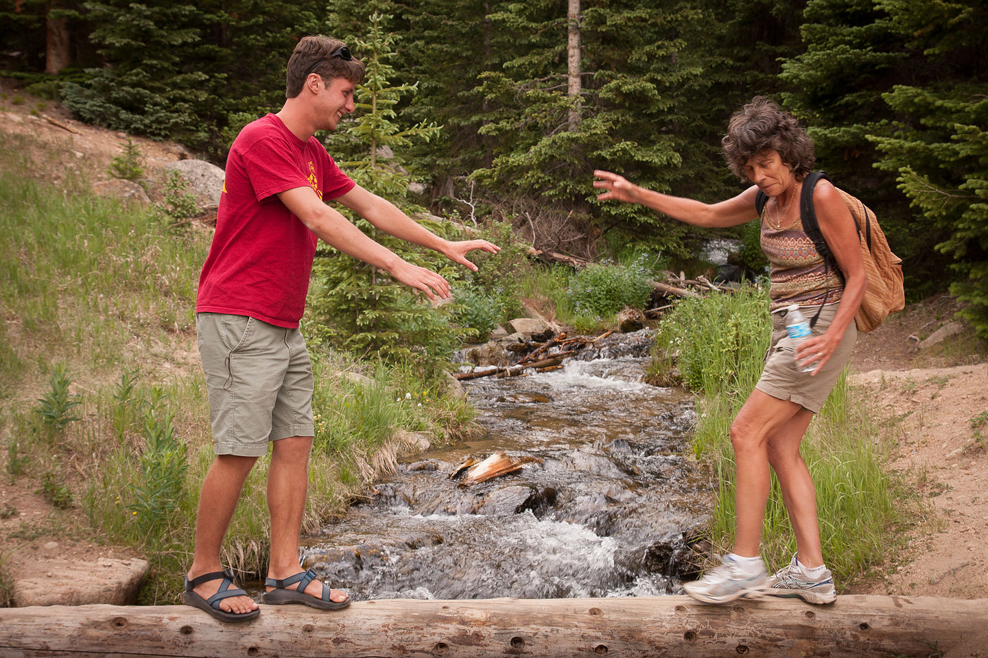 Tommy helping Lolo Cross the Creek