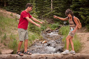 Tommy helping Lolo Cross the Creek