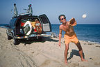 Herb playing catch on beach