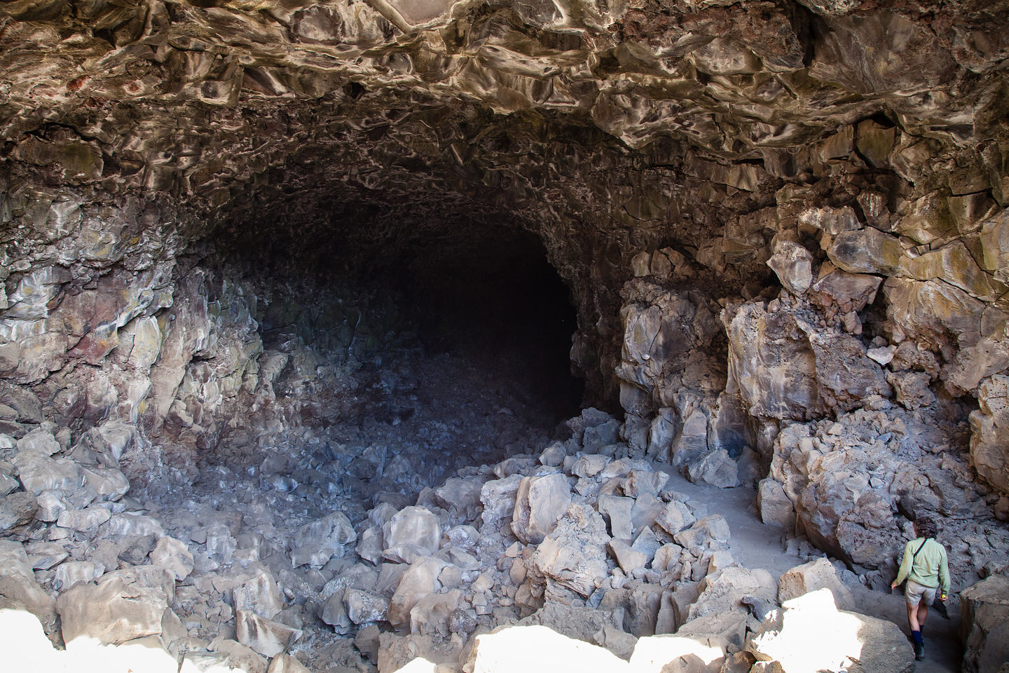 Lolo Approaching Lava Tube Cave Entrance Lolo Approaching Lava Tube Cave Entrance