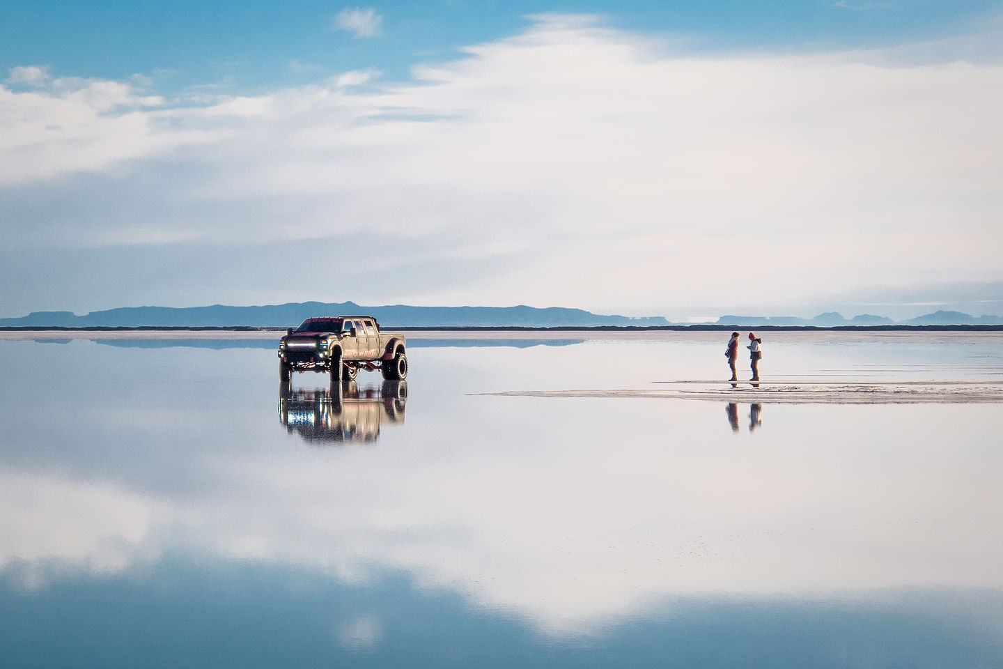 Truck on Bonneville Salt Flats with Couple