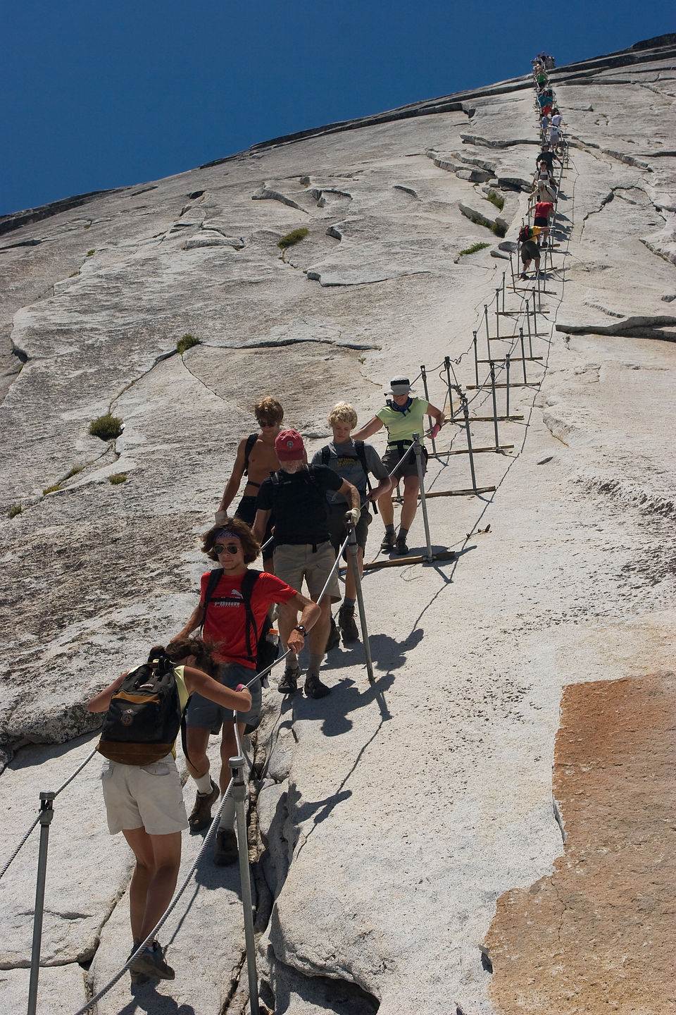 Lolo cautiously descending Half Dome cables Lolo cautiously descending Half Dome cables