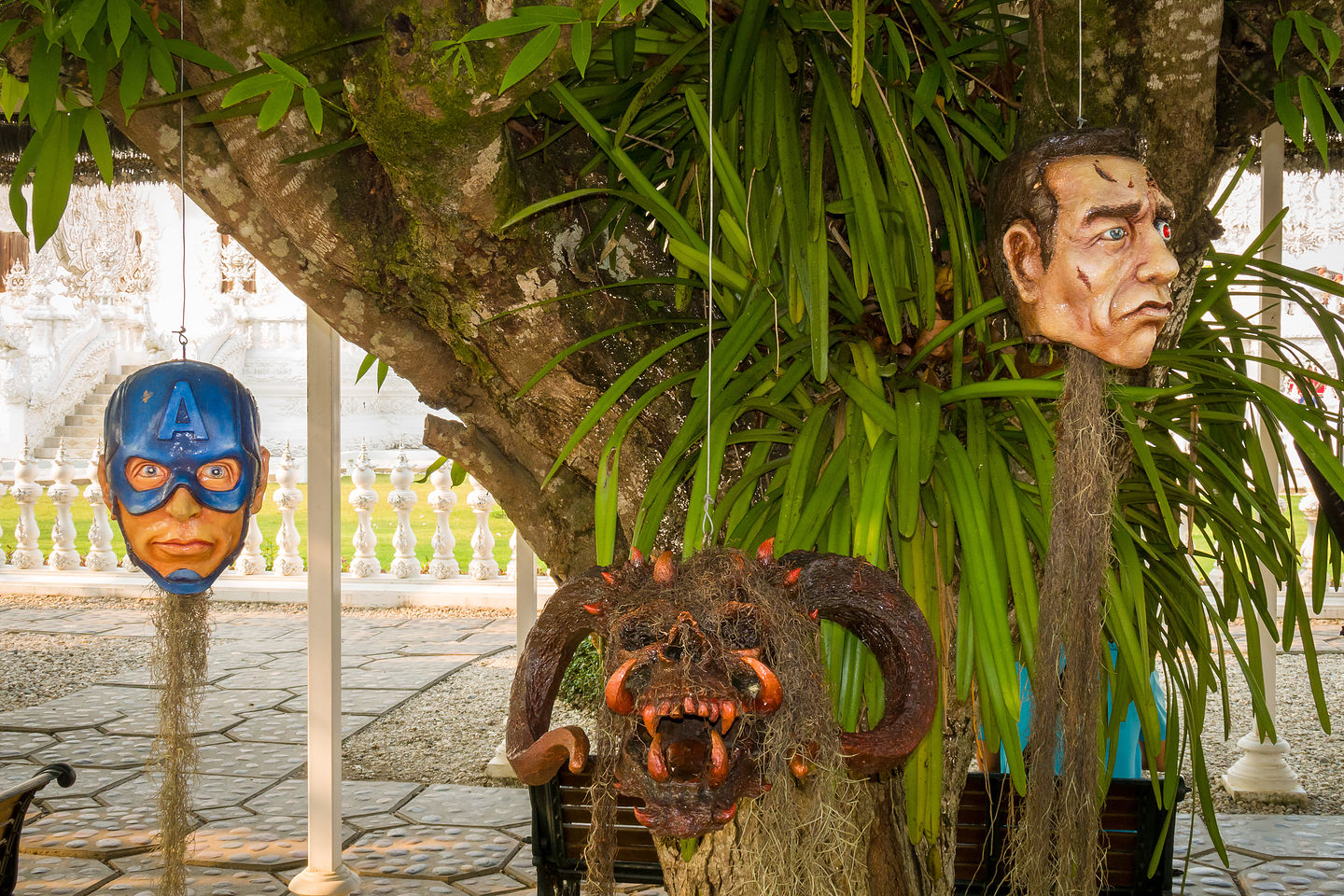 Creepy heads hanging from trees at the White Temple Creepy heads hanging from trees at the White Temple