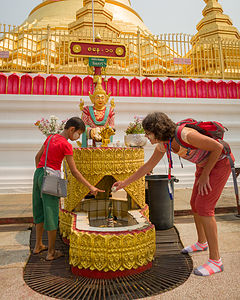 Lolo's little friend helping her through her Buddhist rituals