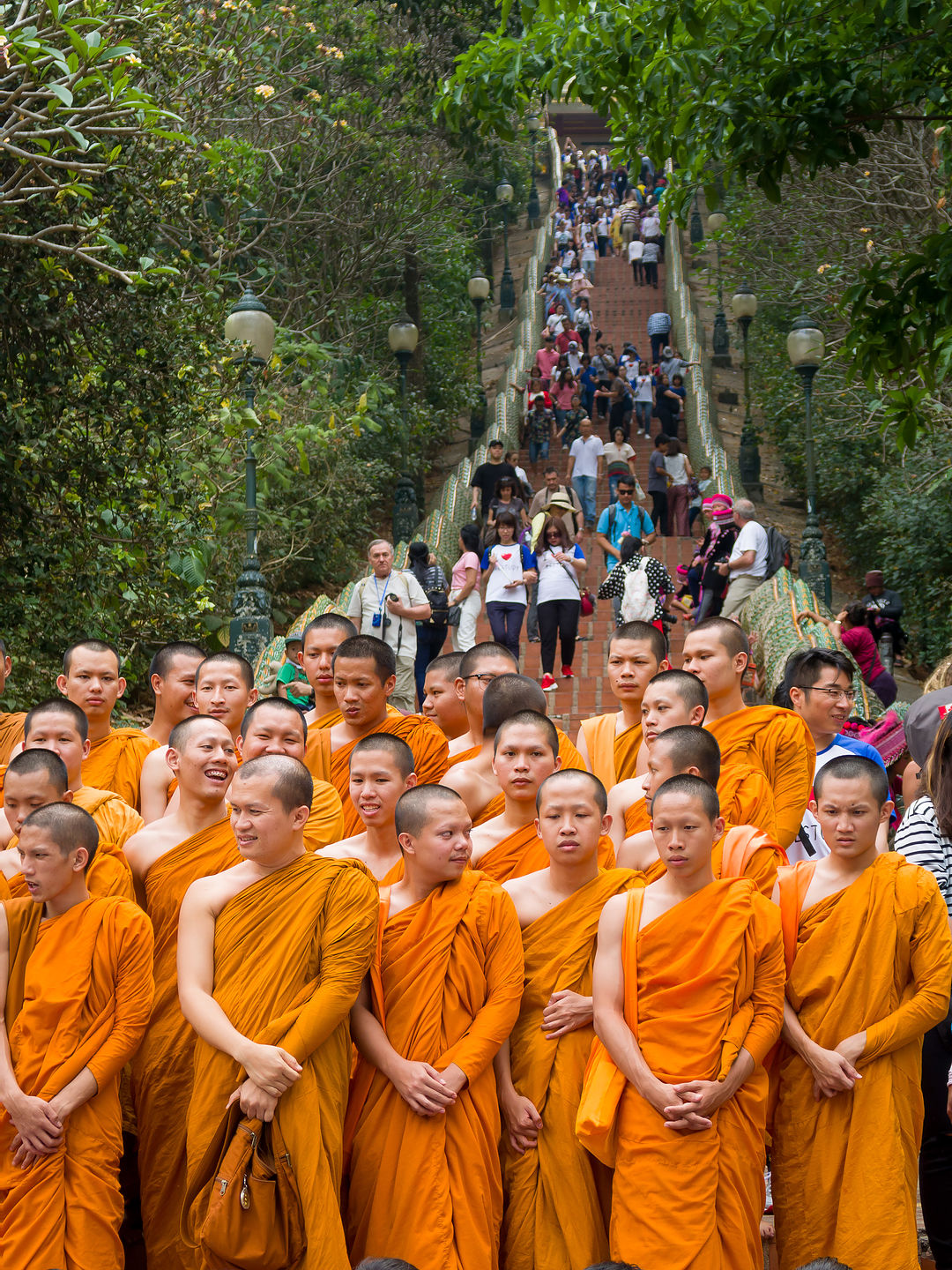 Monks about to earn Buddhist merits by climbing stairs to temple Monks about to earn Buddhist merits by climbing stairs to temple