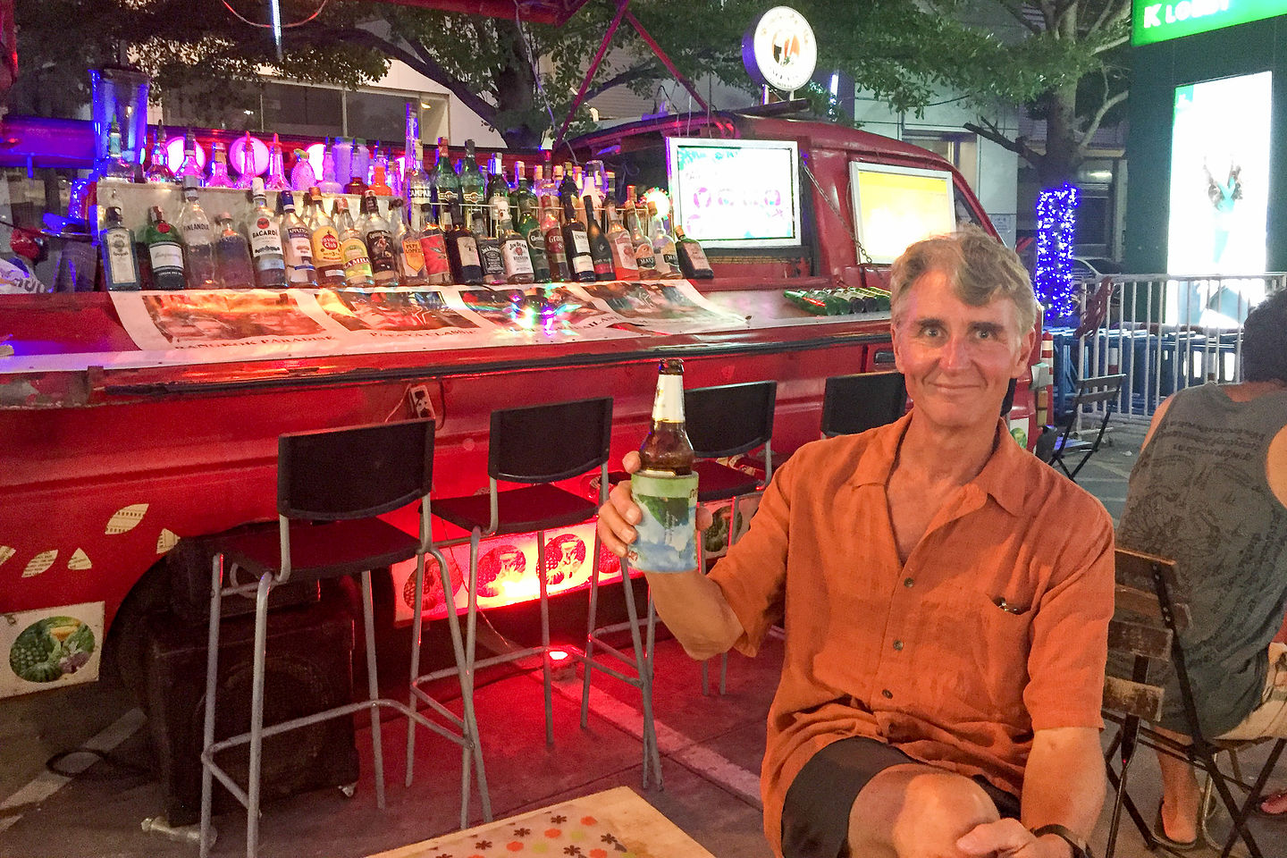 Herb enjoyinga beer at the Suvarnabhumi Night Market Herb enjoyinga beer at the Suvarnabhumi Night Market