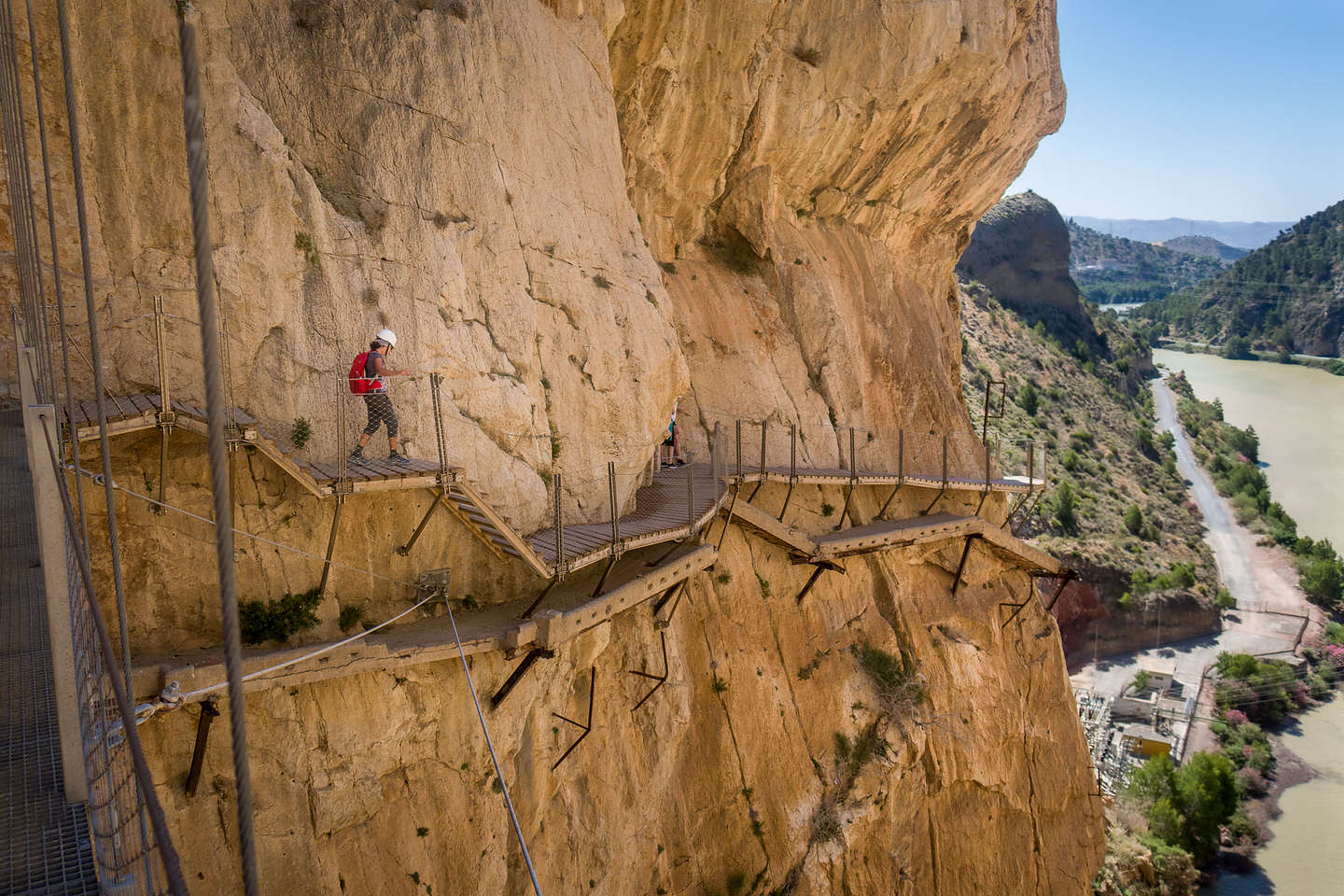 Lolo hiking on the new route, with the old deteriorated one below