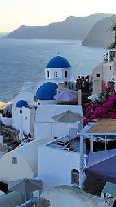 The beautiful white and blue-domed churches of Oia