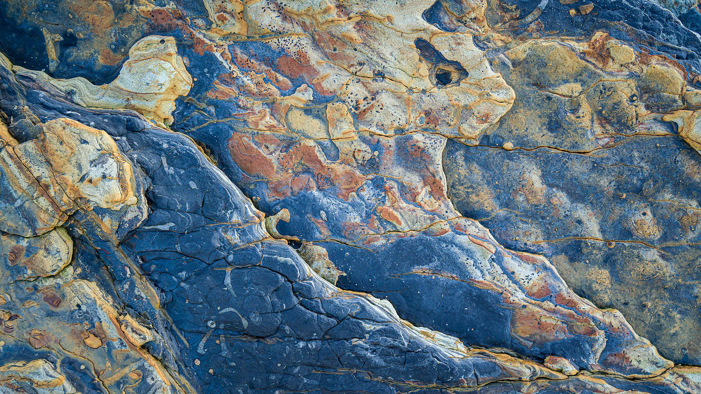 The rocks come alive on Weston Beach at sunset The rocks come alive on Weston Beach at sunset