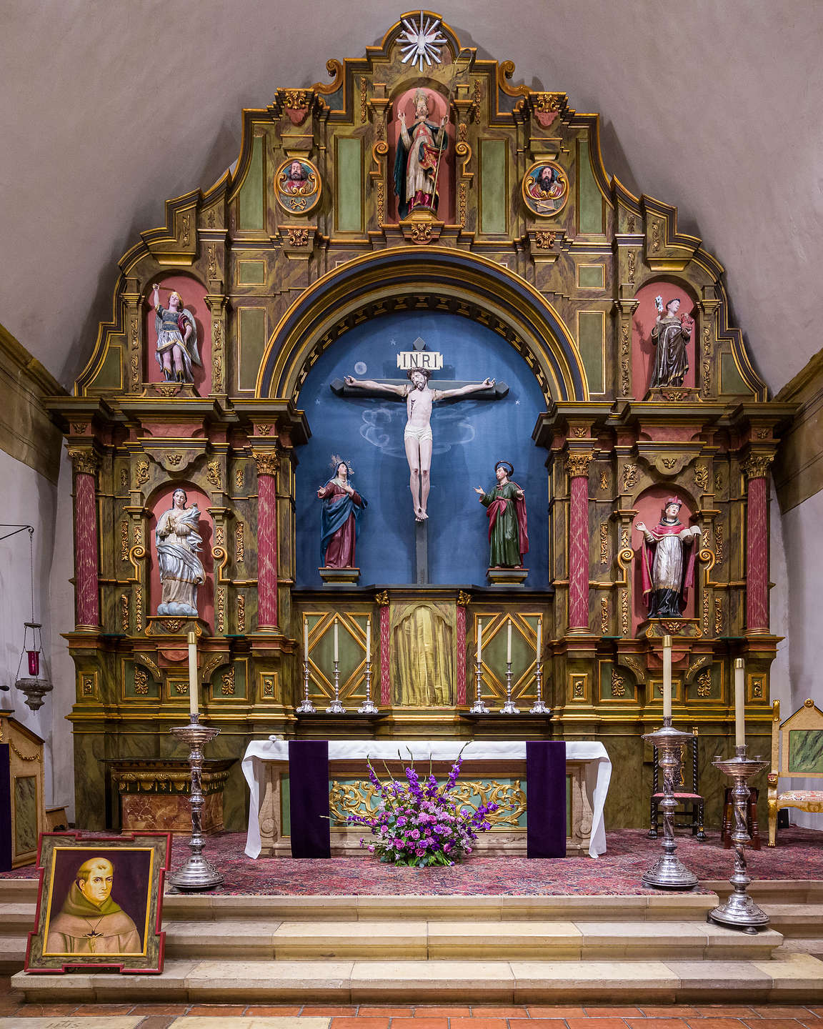 Carmel Mission Altar with portrait of Juniper Serra Carmel Mission Altar with portrait of Juniper Serra