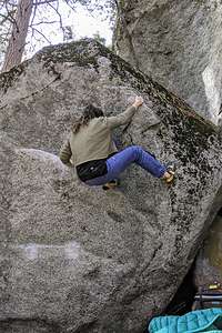 Erin bouldering without a wedding dress